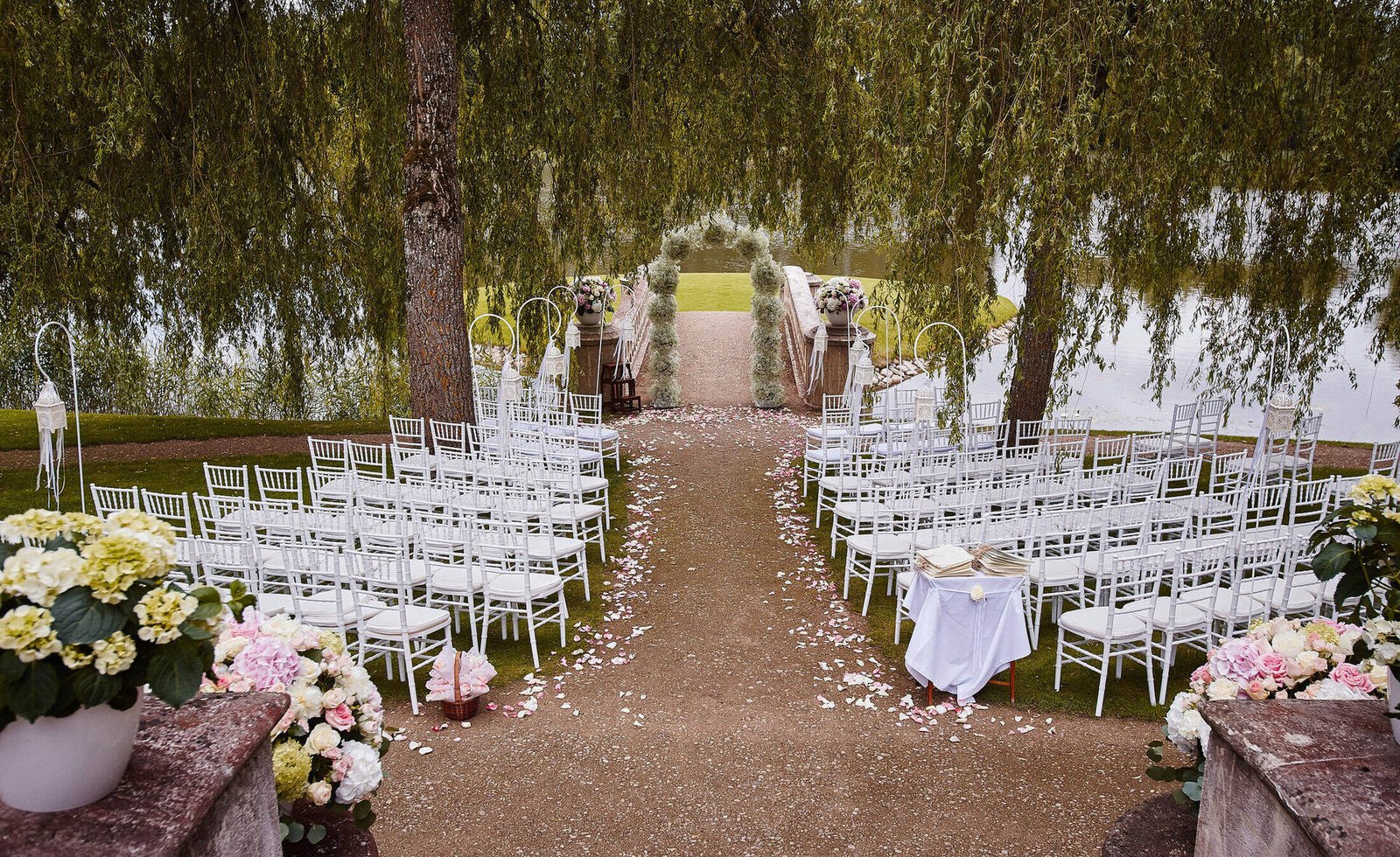 Wedding ceremony arch adorned with premium luxury florals